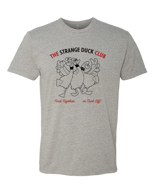 Dark heather tee with cartoon image of three ducks partying. Text in black and red reads "Strange Duck Club - Flock Together . . . or Flock Off!"