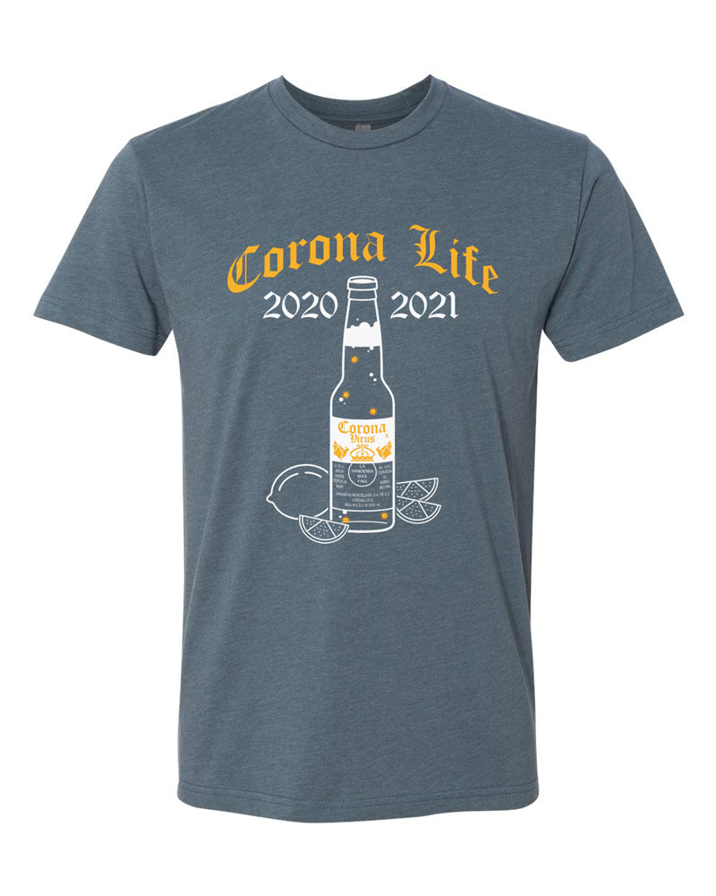 Indigo tee with gold blackletter text that reads "Corona Life 2020-2021" over white beer bottle with small gold coronaviruses inside.